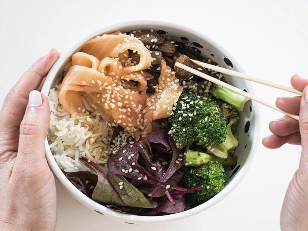 Bowl of rice, vegetables and salmon